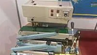 Полуавтомат для непрерывного запаивания пакетов с продукцией Hualian FRB-770II